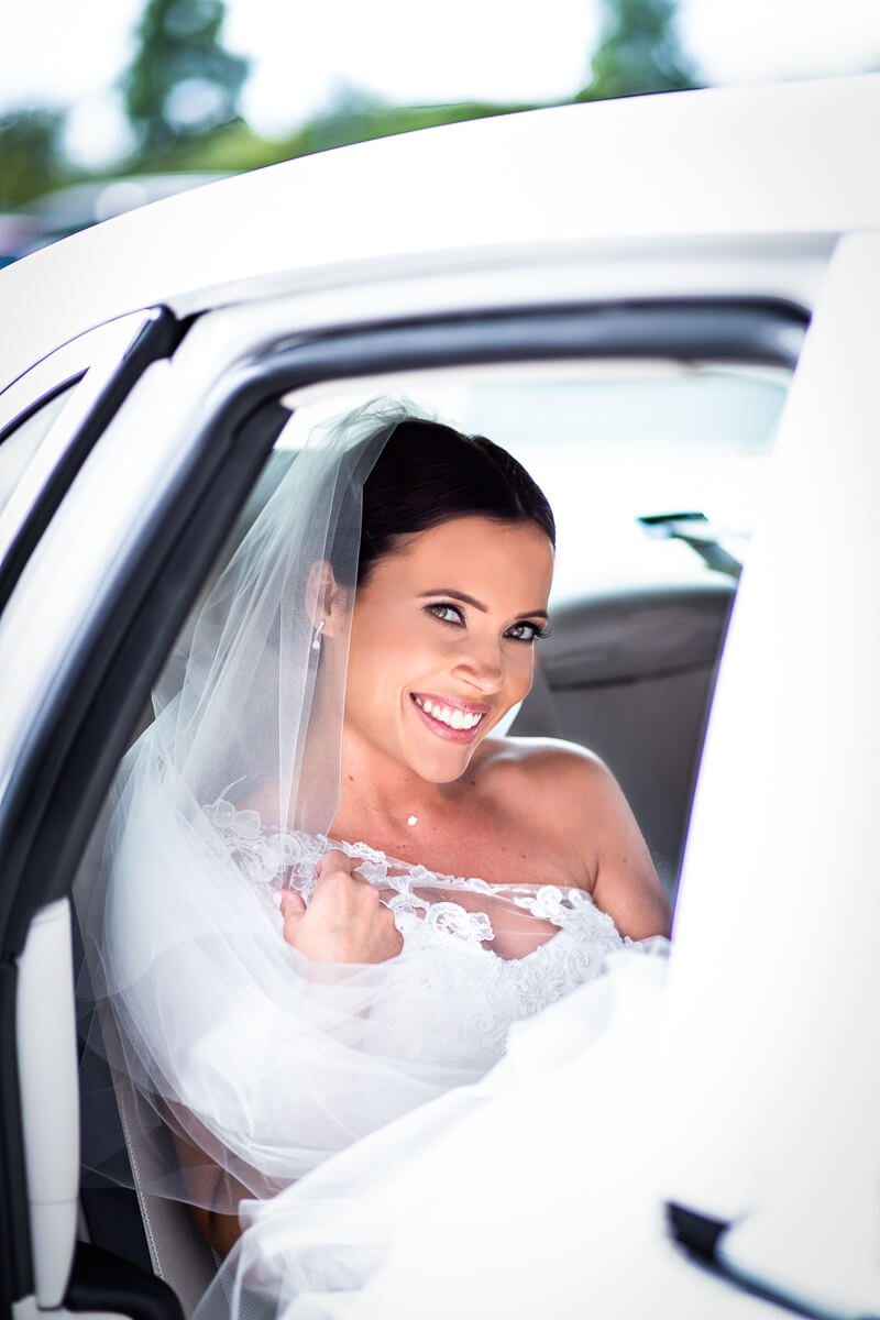 Wedding car bride pose